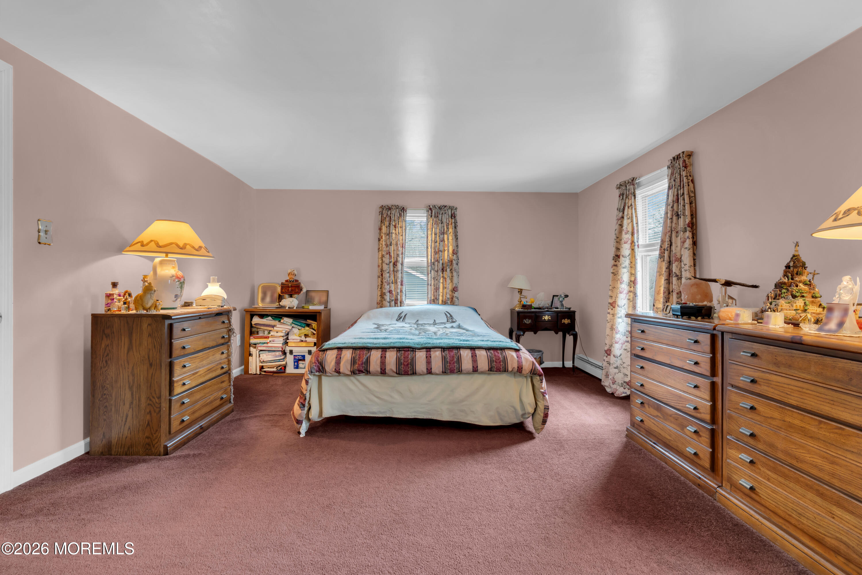 267 Phalanx Road Colts Neck, NJ 07722 - Photo 24 of 36 a bedroom with a bed and a dresser in it