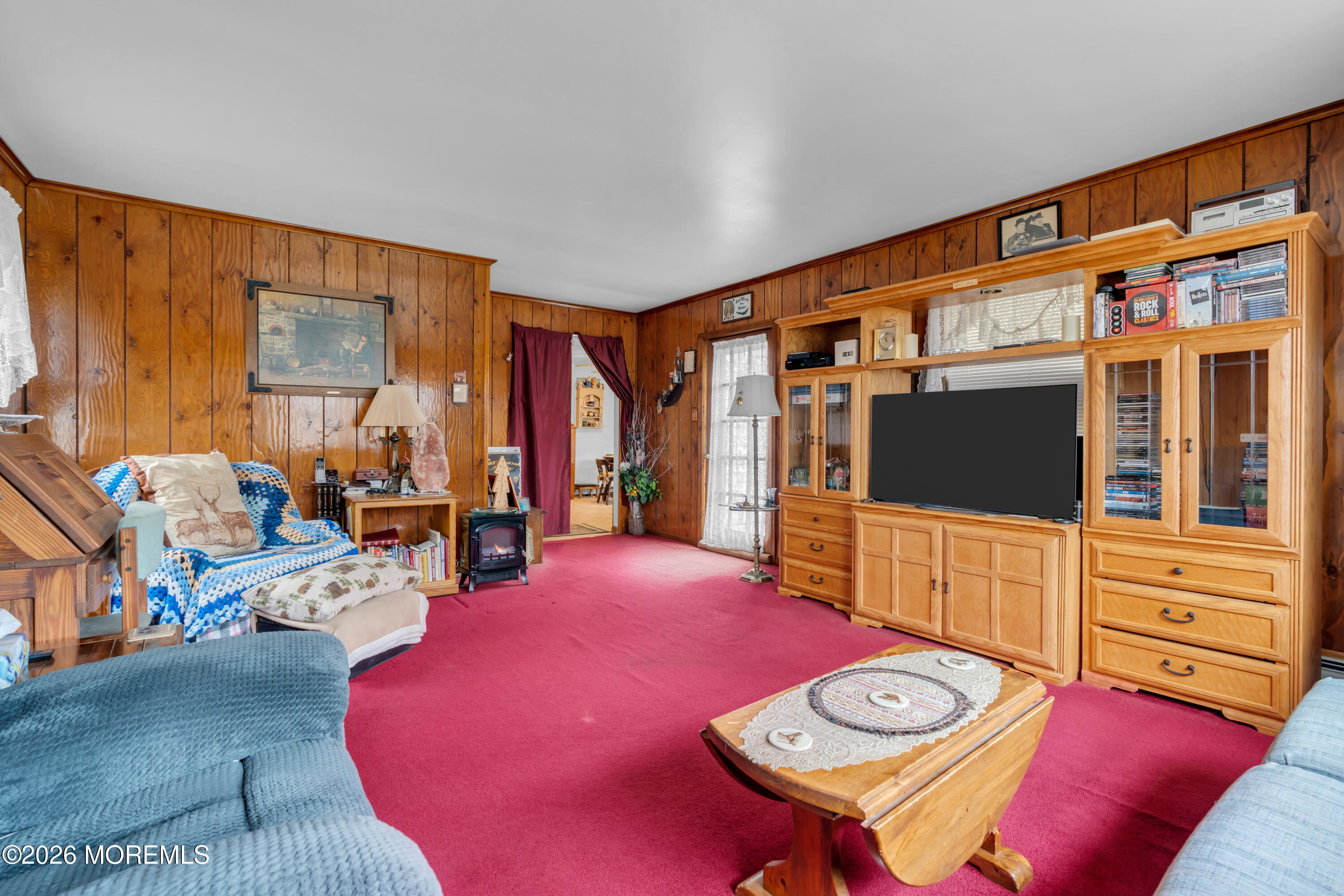267 Phalanx Road Colts Neck, NJ 07722 - Photo 26 of 36 a living room with furniture and a flat screen tv