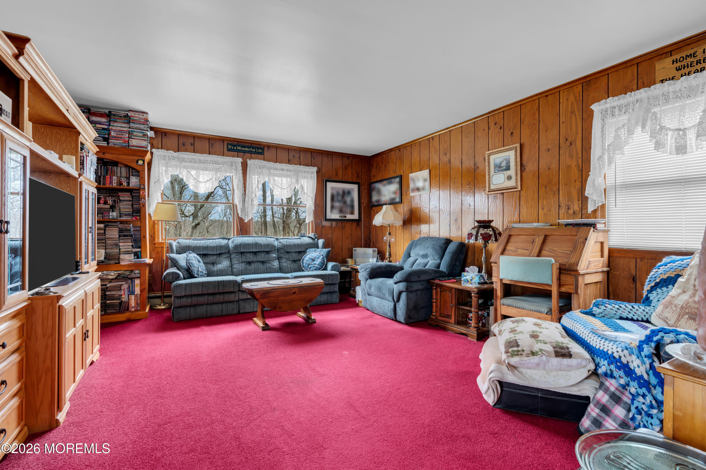267 Phalanx Road Colts Neck, NJ 07722 - Photo 27 of 36 a living room with furniture and a flat screen tv