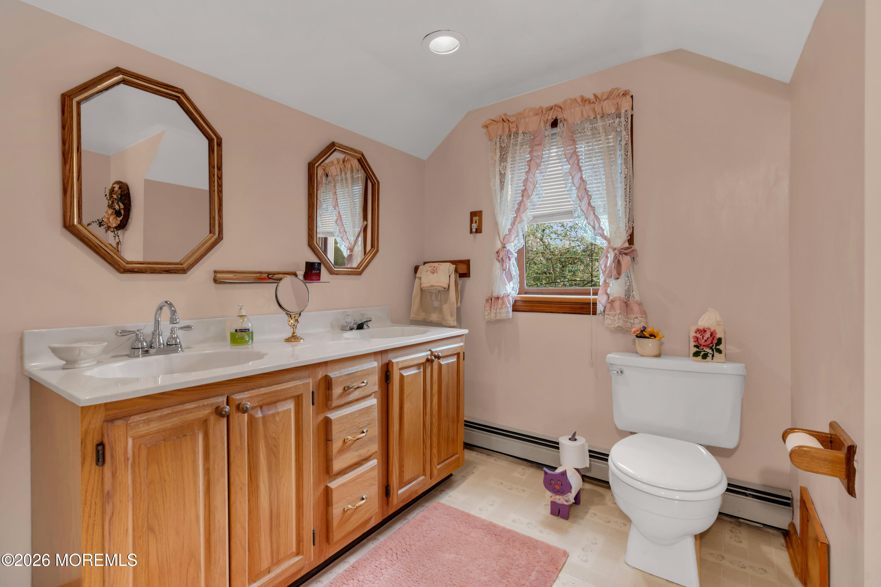 267 Phalanx Road Colts Neck, NJ 07722 - Photo 28 of 36 a bathroom with a toilet a sink and a mirror