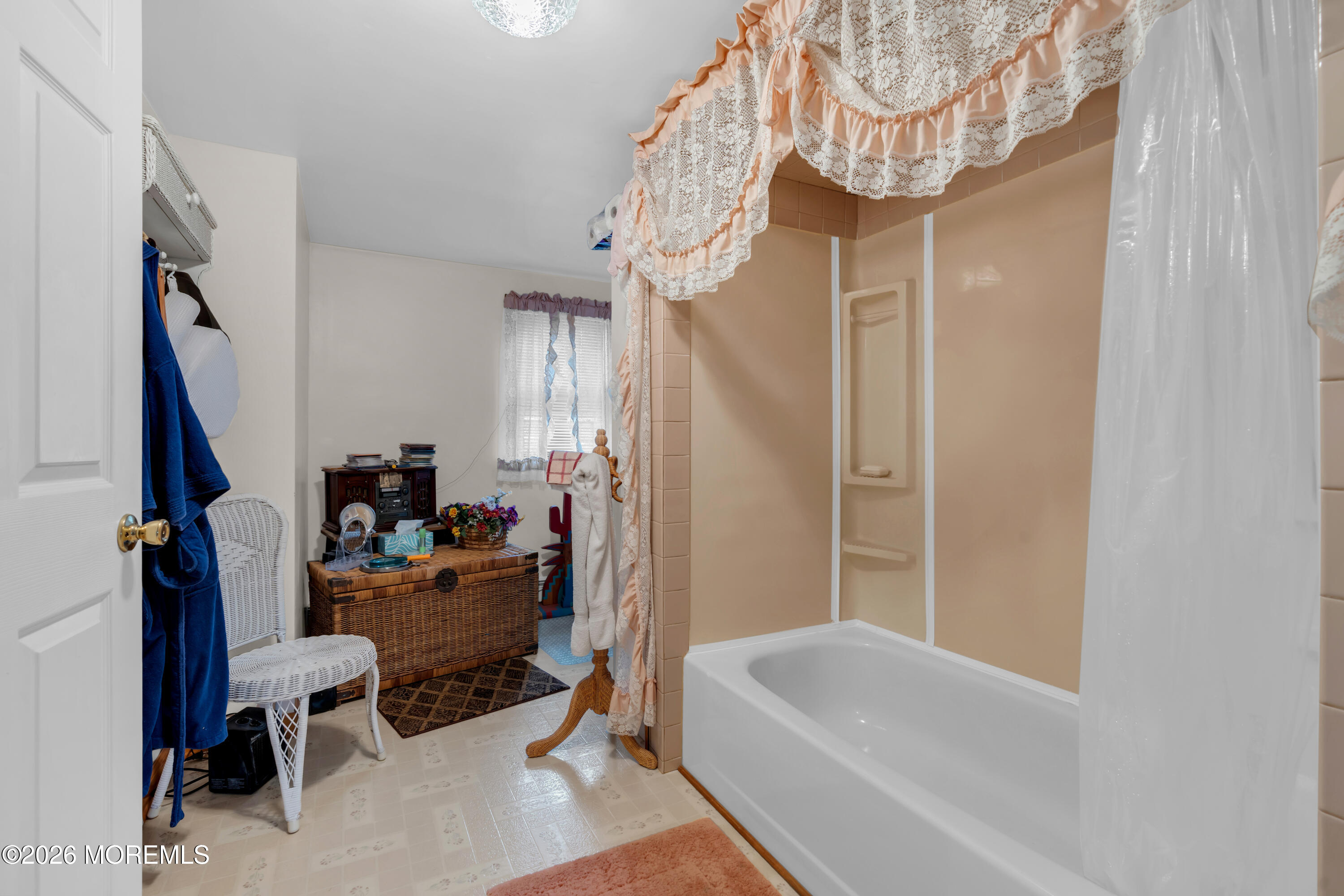 267 Phalanx Road Colts Neck, NJ 07722 - Photo 29 of 36 a living room with furniture and a chandelier