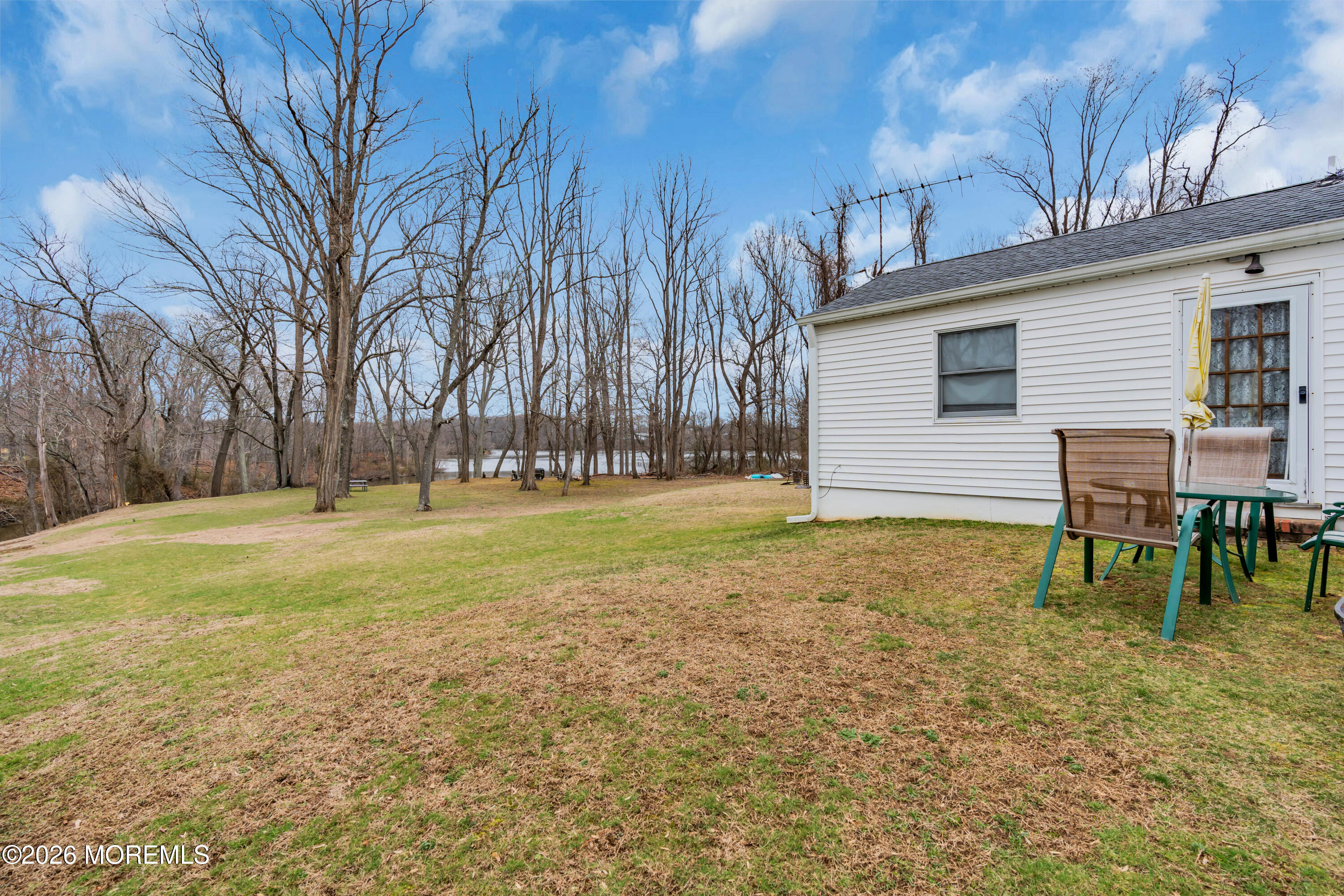 267 Phalanx Road Colts Neck, NJ 07722 - Photo 30 of 36 a backyard of a house with lots of green space