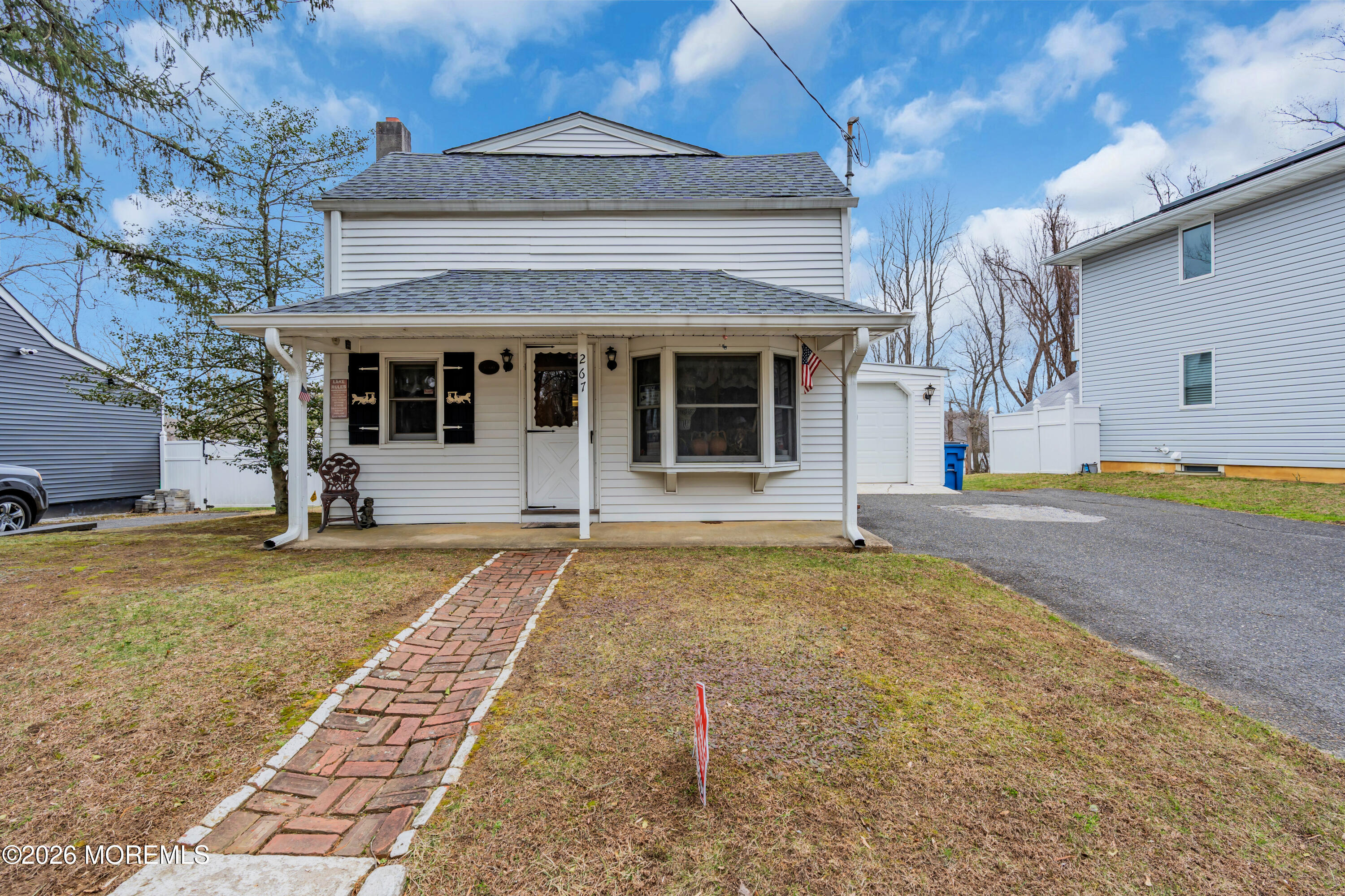 267 Phalanx Road Colts Neck, NJ 07722 - Photo 9 of 36 a house with trees in front of it