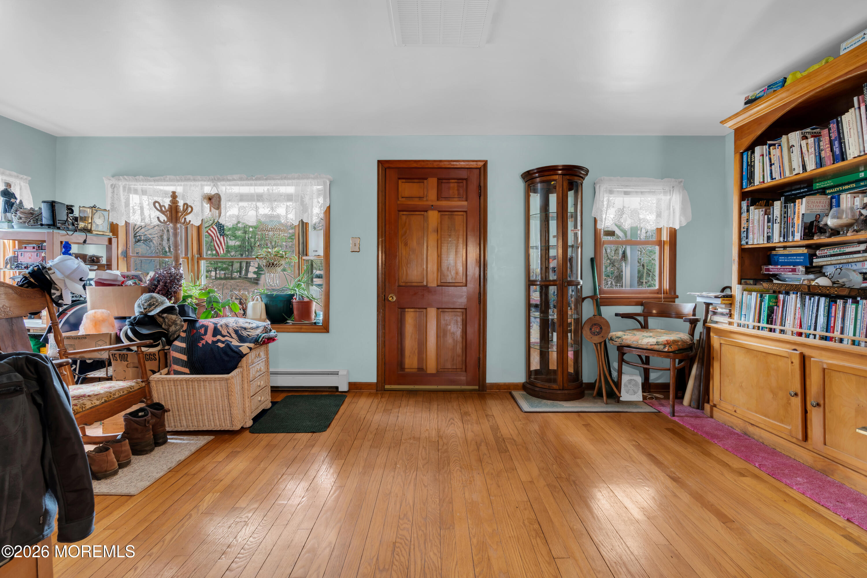 267 Phalanx Road Colts Neck, NJ 07722 - Photo 10 of 36 a living room with furniture and a wooden floor