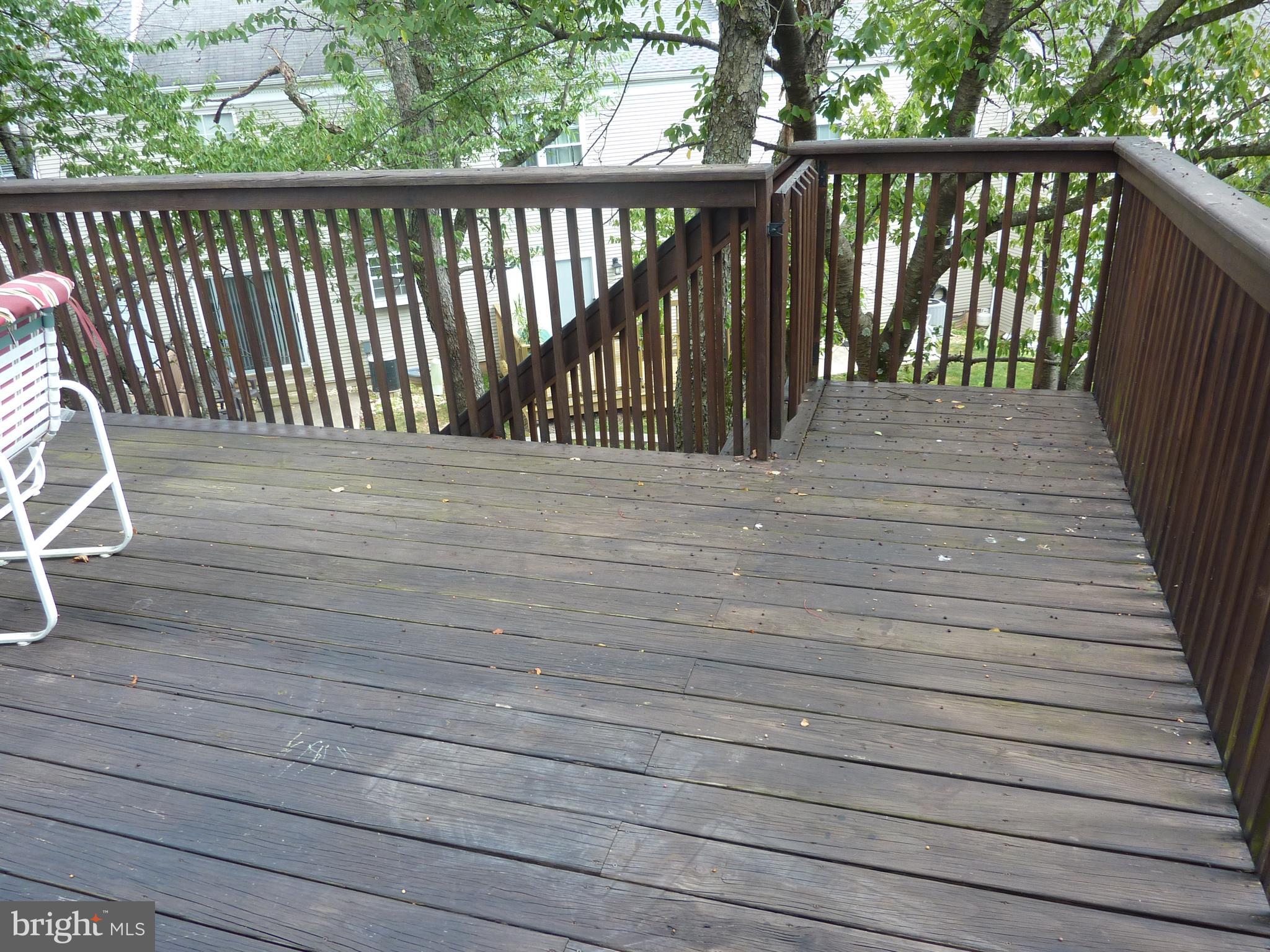 1026 Rafter Road Jeffersonville, PA 19403 - Photo 22 of 27 Deck with Stairs Accessing Lower Level Patio