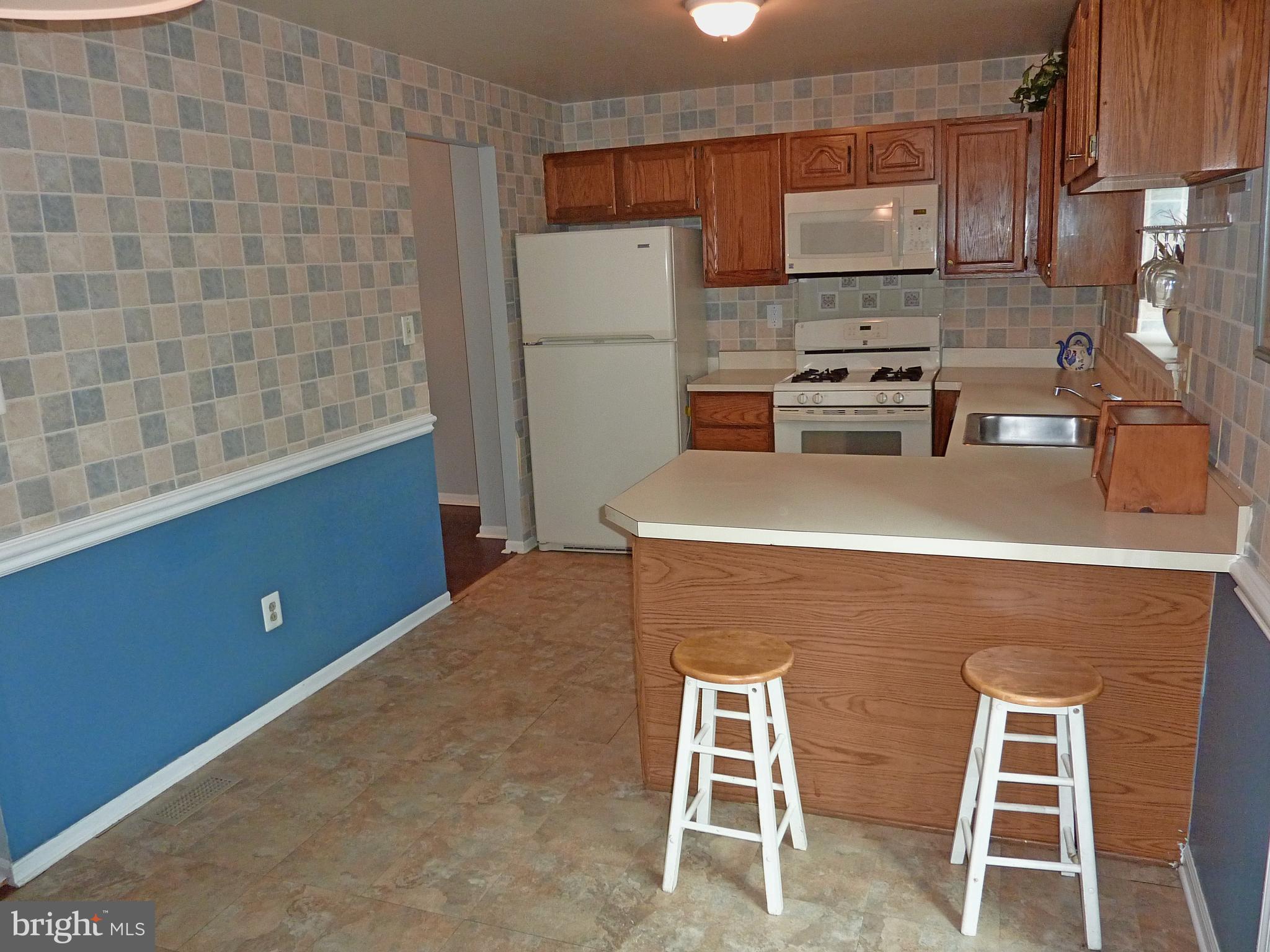 1026 Rafter Road Jeffersonville, PA 19403 - Photo 5 of 27 Kitchen-Breakfast Bar with Bar Stools