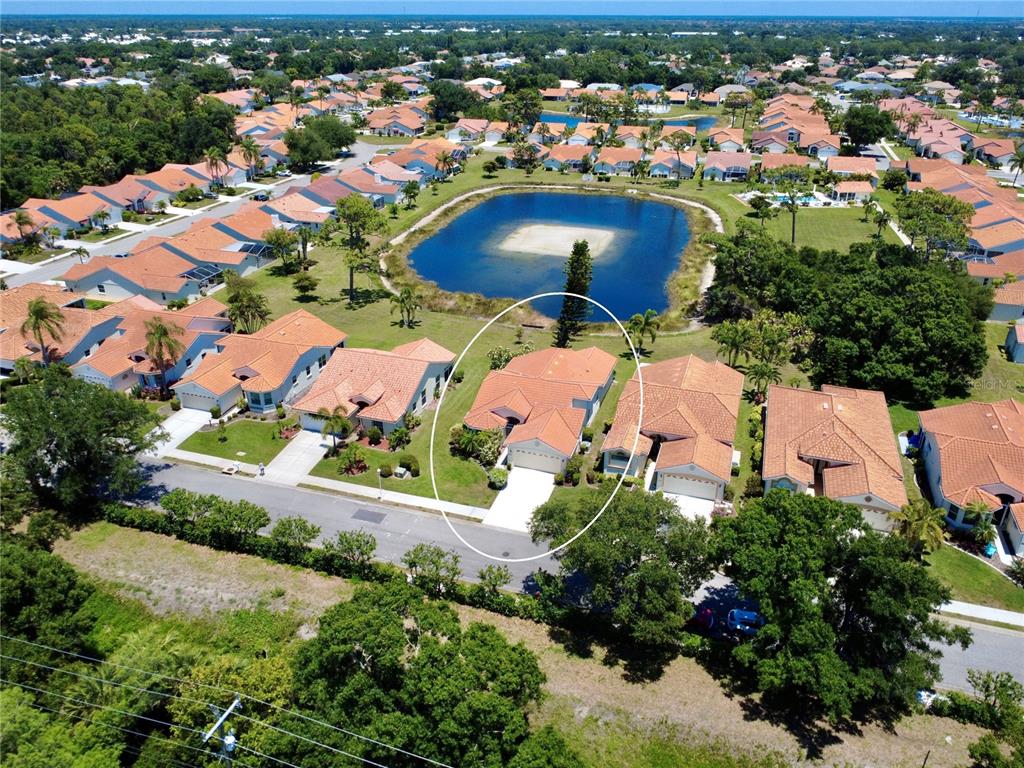 4266 Summertree Road Venice, FL 34293 - Photo 44 of 64 an aerial view of residential houses with outdoor space