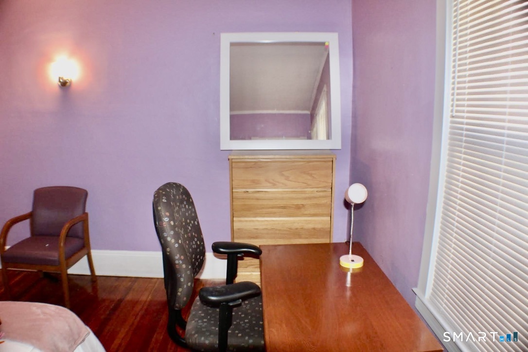 150 Whitney Street Hartford, CT 06105 - Photo 34 of 39 a view of a room with furniture and wooden floor