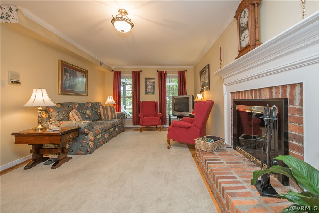 12941 Spring Run Road Midlothian, VA 23112 - Photo 17 of 48 a living room with furniture gym equipment and a fireplace