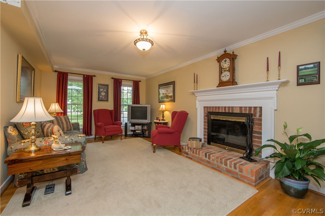 12941 Spring Run Road Midlothian, VA 23112 - Photo 18 of 48 a living room with furniture and a fireplace
