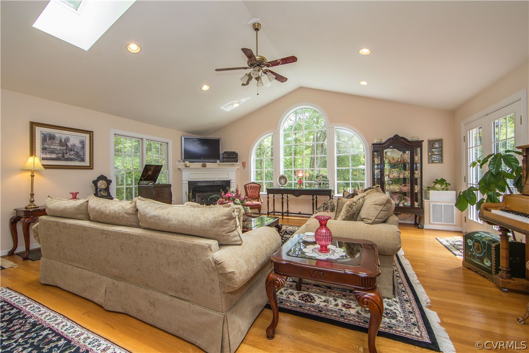 12941 Spring Run Road Midlothian, VA 23112 - Photo 20 of 48 a living room with furniture fireplace and a large window