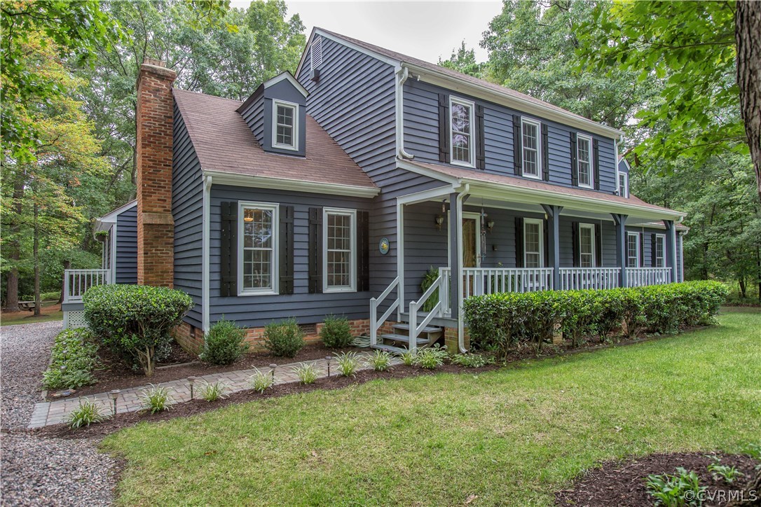 12941 Spring Run Road Midlothian, VA 23112 - Photo 2 of 48 a front view of a house with garden