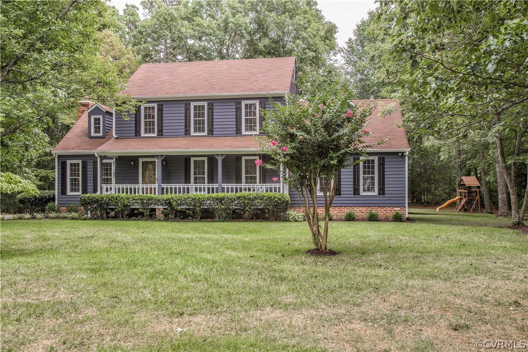 12941 Spring Run Road Midlothian, VA 23112 - Photo 3 of 48 a front view of a house with a yard