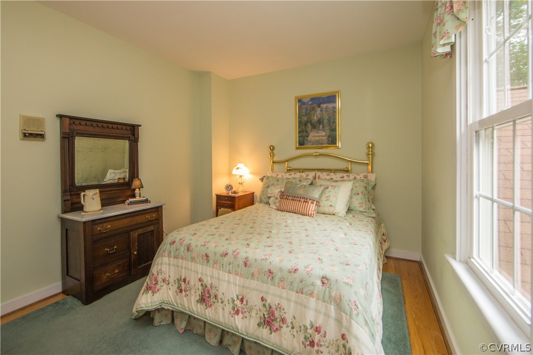 12941 Spring Run Road Midlothian, VA 23112 - Photo 34 of 48 a bedroom with a bed and a dresser next to a window