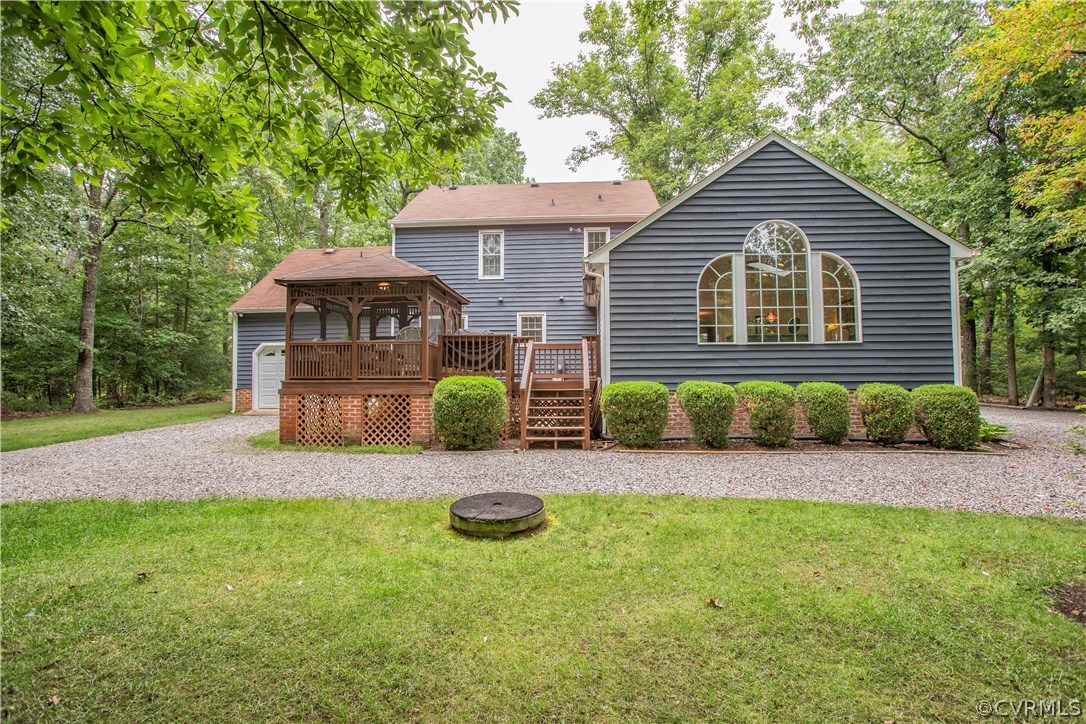 12941 Spring Run Road Midlothian, VA 23112 - Photo 4 of 48 a front view of a house with a yard and porch