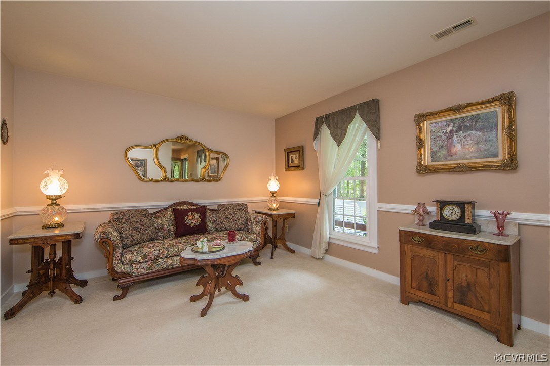 12941 Spring Run Road Midlothian, VA 23112 - Photo 7 of 48 a living room with furniture and a window