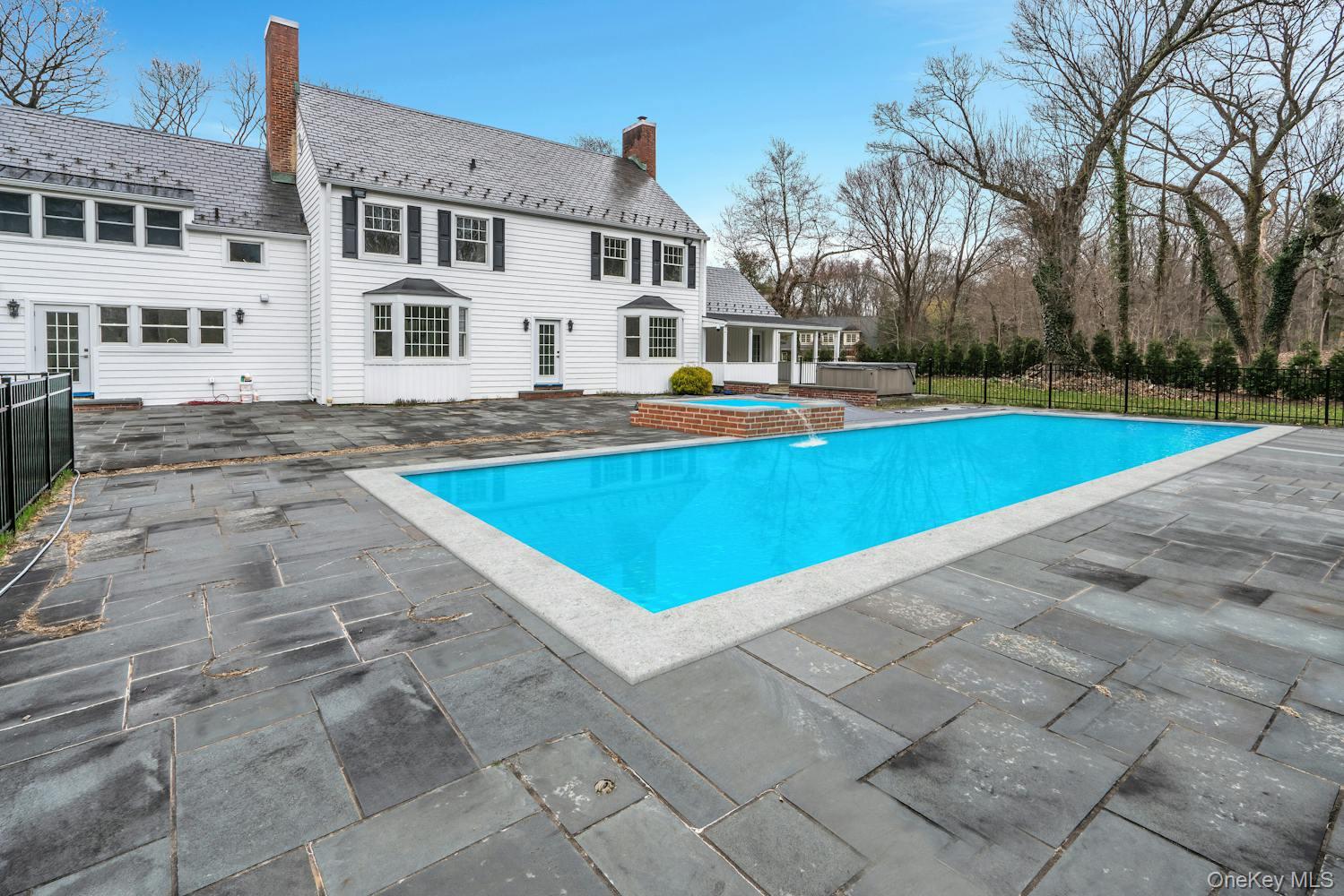 539 Split Rock Road Syosset, NY 11791 - Photo 36 of 40 View of swimming pool featuring a fenced in pool, fence, a hot tub, and a patio area