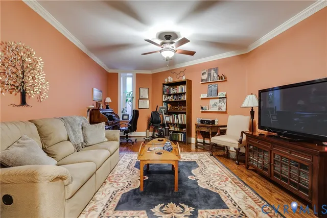 a living room with furniture and a flat screen tv