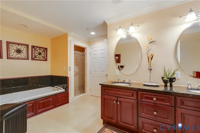 a spacious bathroom with a double vanity sink and a mirror