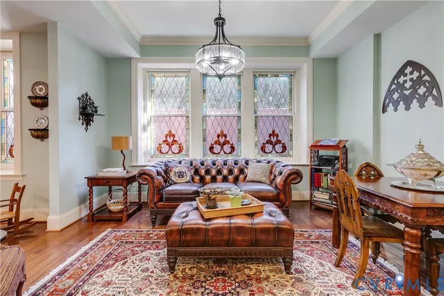 a living room filled with furniture chandelier and a chandelier