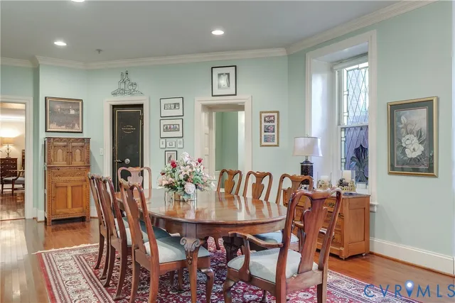 a view of a dining room with furniture and wooden floor