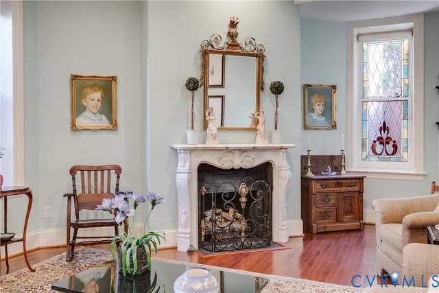 a living room with furniture and a fireplace