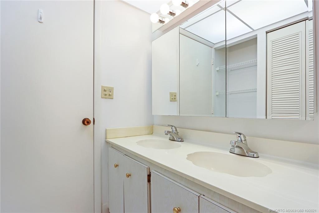 5443 Southeast Miles Grant Road, Unit D205 Stuart, FL 34997 - Photo 22 of 44 Owners Bath with Extra Storage