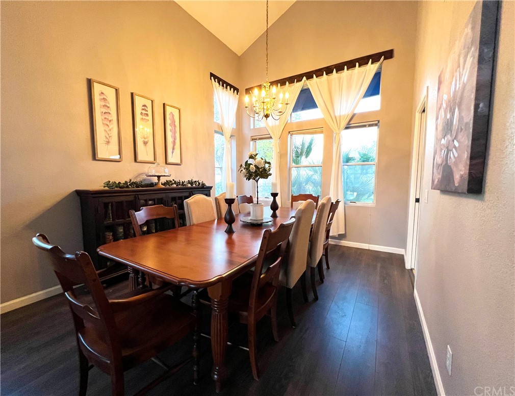 43 Corte Rivera Lake Elsinore, CA 92532 - Photo 12 of 32 a view of a a dining room with furniture window and wooden floor