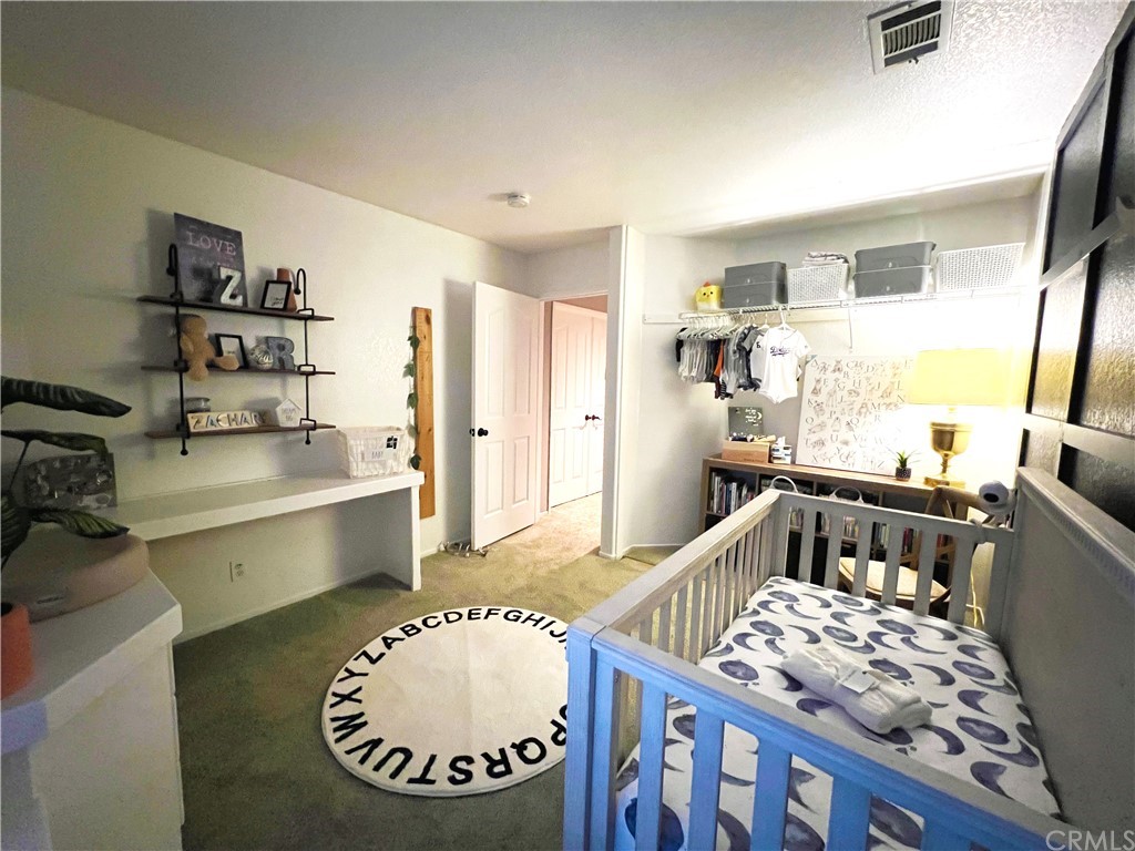 43 Corte Rivera Lake Elsinore, CA 92532 - Photo 29 of 32 a living room with furniture and a wooden floor