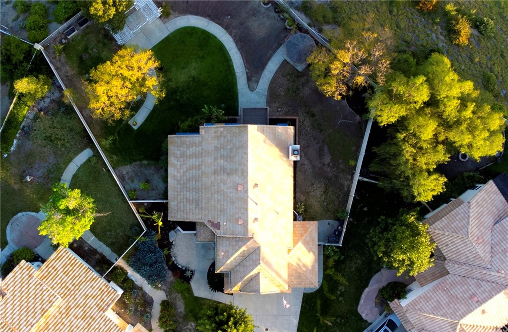 43 Corte Rivera Lake Elsinore, CA 92532 - Photo 6 of 32 an aerial view of a house with swimming pool and garden