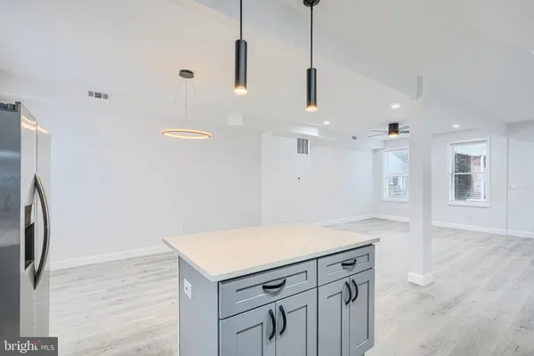 a kitchen with a refrigerator a sink and dishwasher
