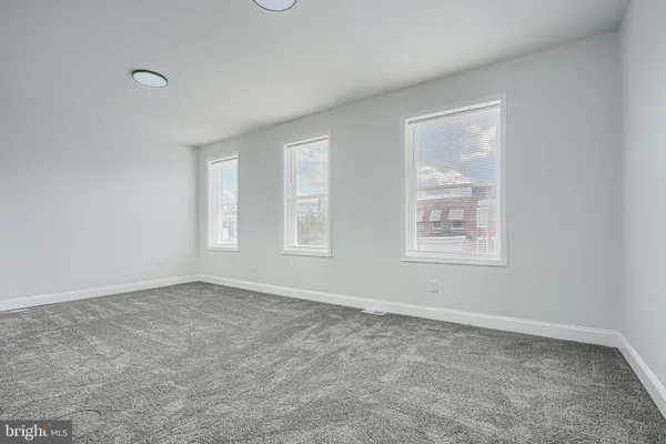 an empty room with windows