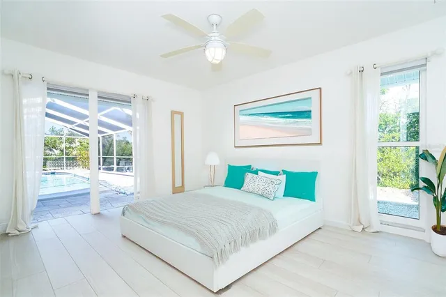 a view of a house with backyard and a tree