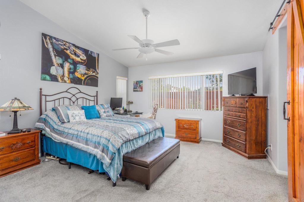 4895 Lake Shore Place Fallbrook, CA 92028 - Photo 12 of 27 a bedroom with a bed and a dresser in it