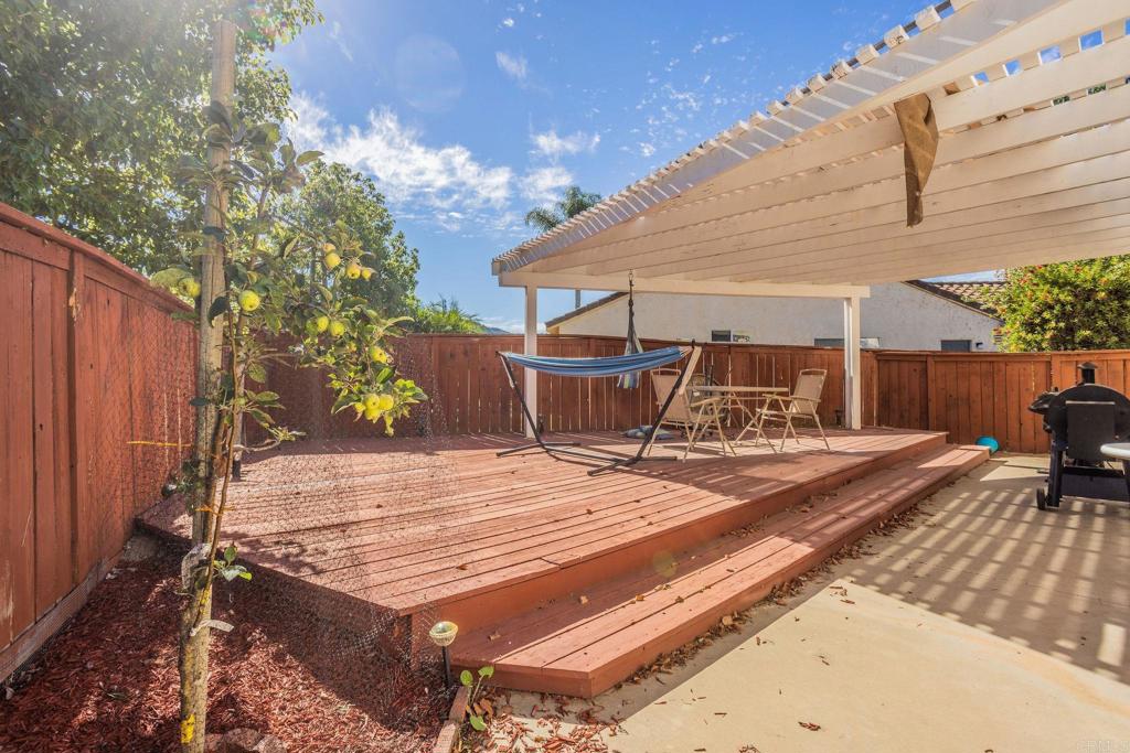 4895 Lake Shore Place Fallbrook, CA 92028 - Photo 15 of 27 a view of a backyard with sitting area