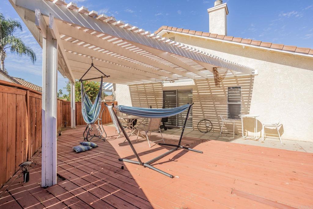 4895 Lake Shore Place Fallbrook, CA 92028 - Photo 16 of 27 a building outdoor space with a patio outdoor seating and a projector
