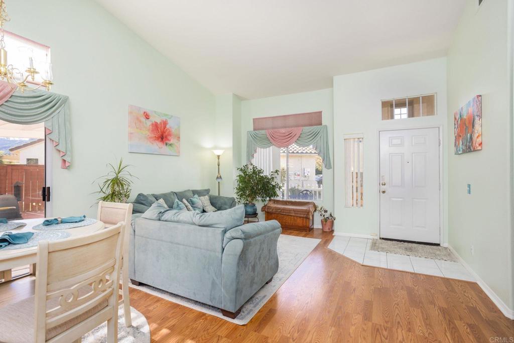 4895 Lake Shore Place Fallbrook, CA 92028 - Photo 2 of 27 a living room with furniture and a wooden floor