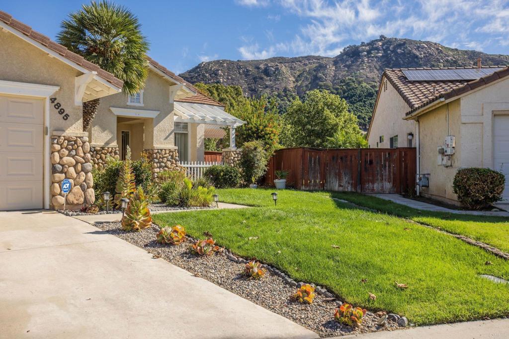 4895 Lake Shore Place Fallbrook, CA 92028 - Photo 21 of 27 a front view of a house with garden
