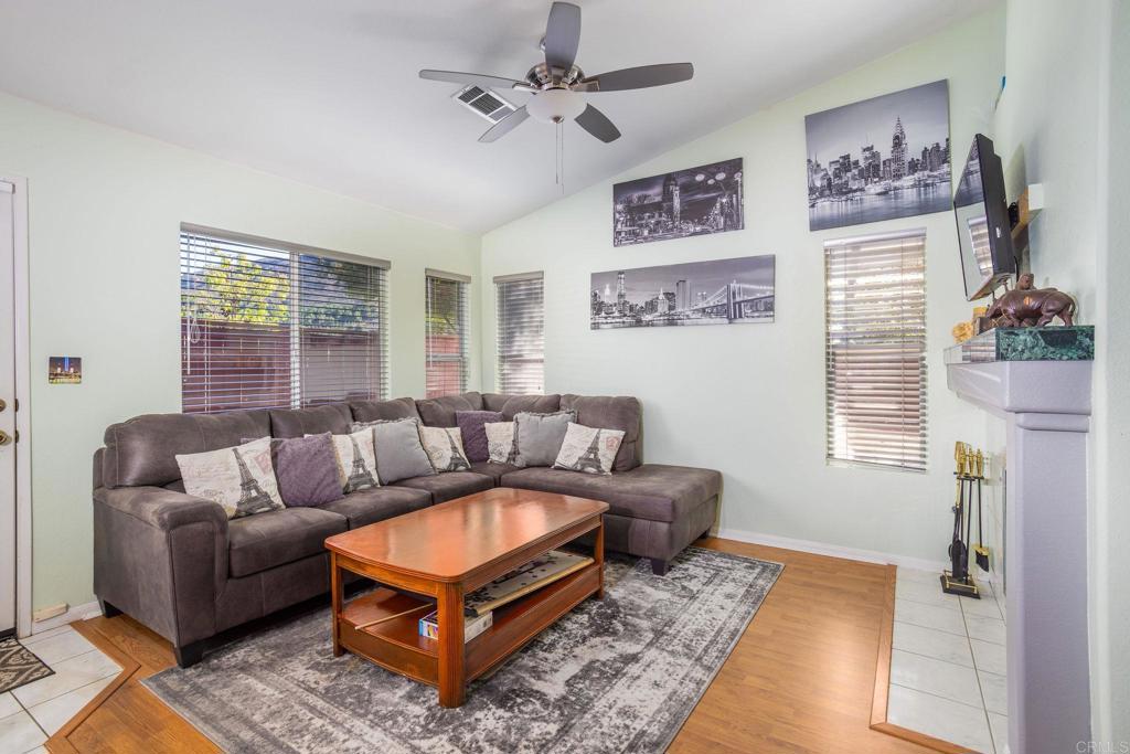 4895 Lake Shore Place Fallbrook, CA 92028 - Photo 7 of 27 a living room with furniture a rug and a flat screen tv