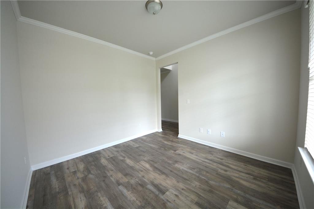 2377 Ticonic Road Lithonia, GA 30058 - Photo 11 of 40 a view of an empty room with wooden floor