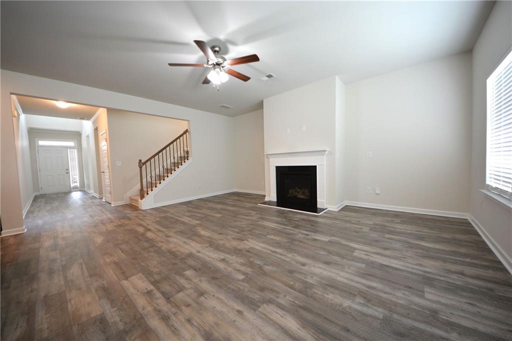 2377 Ticonic Road Lithonia, GA 30058 - Photo 15 of 40 a view of empty room with wooden floor and fan