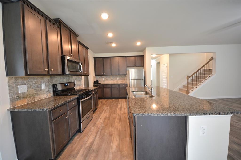 2377 Ticonic Road Lithonia, GA 30058 - Photo 18 of 40 a large kitchen with granite countertop lots of counter top space