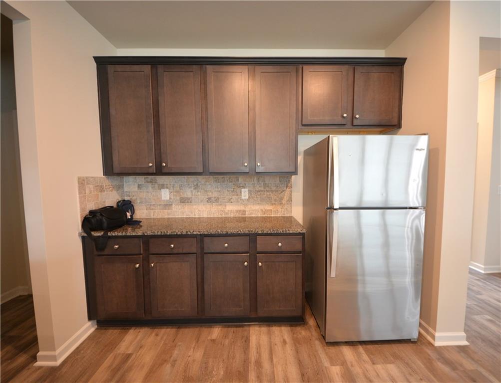 2377 Ticonic Road Lithonia, GA 30058 - Photo 20 of 40 a kitchen with a refrigerator and a sink
