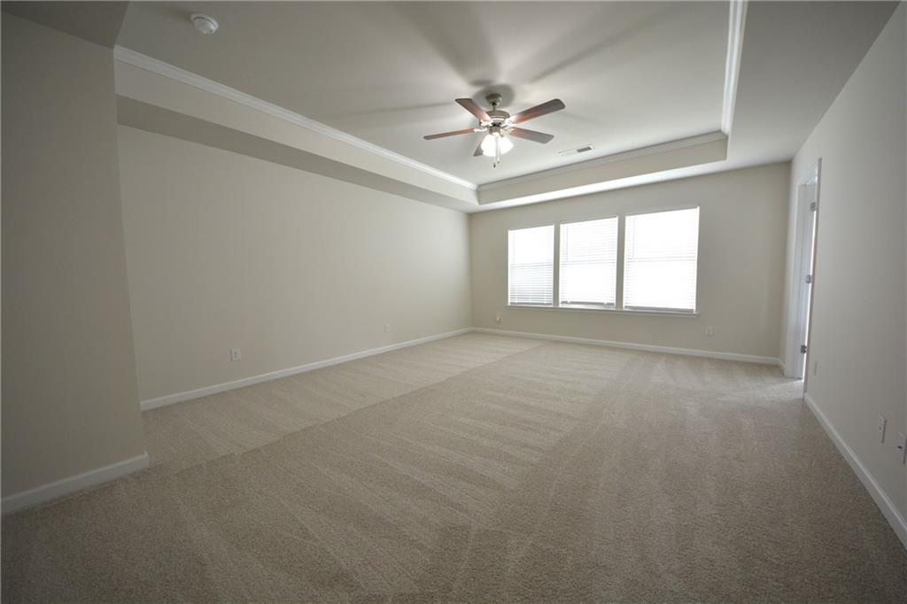 2377 Ticonic Road Lithonia, GA 30058 - Photo 30 of 40 a view of an empty room with chandelier fan and fire place