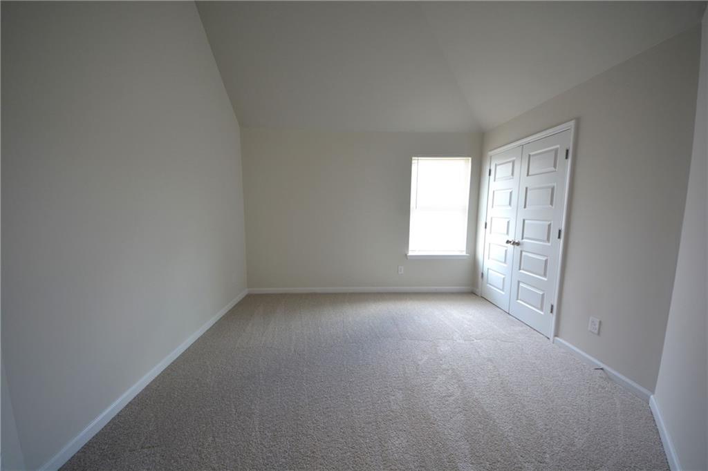 2377 Ticonic Road Lithonia, GA 30058 - Photo 36 of 40 an empty room with windows