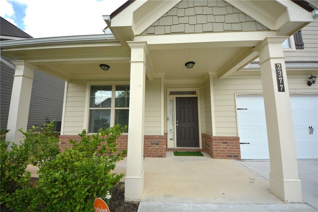 2377 Ticonic Road Lithonia, GA 30058 - Photo 7 of 40 a front view of a house with a plants
