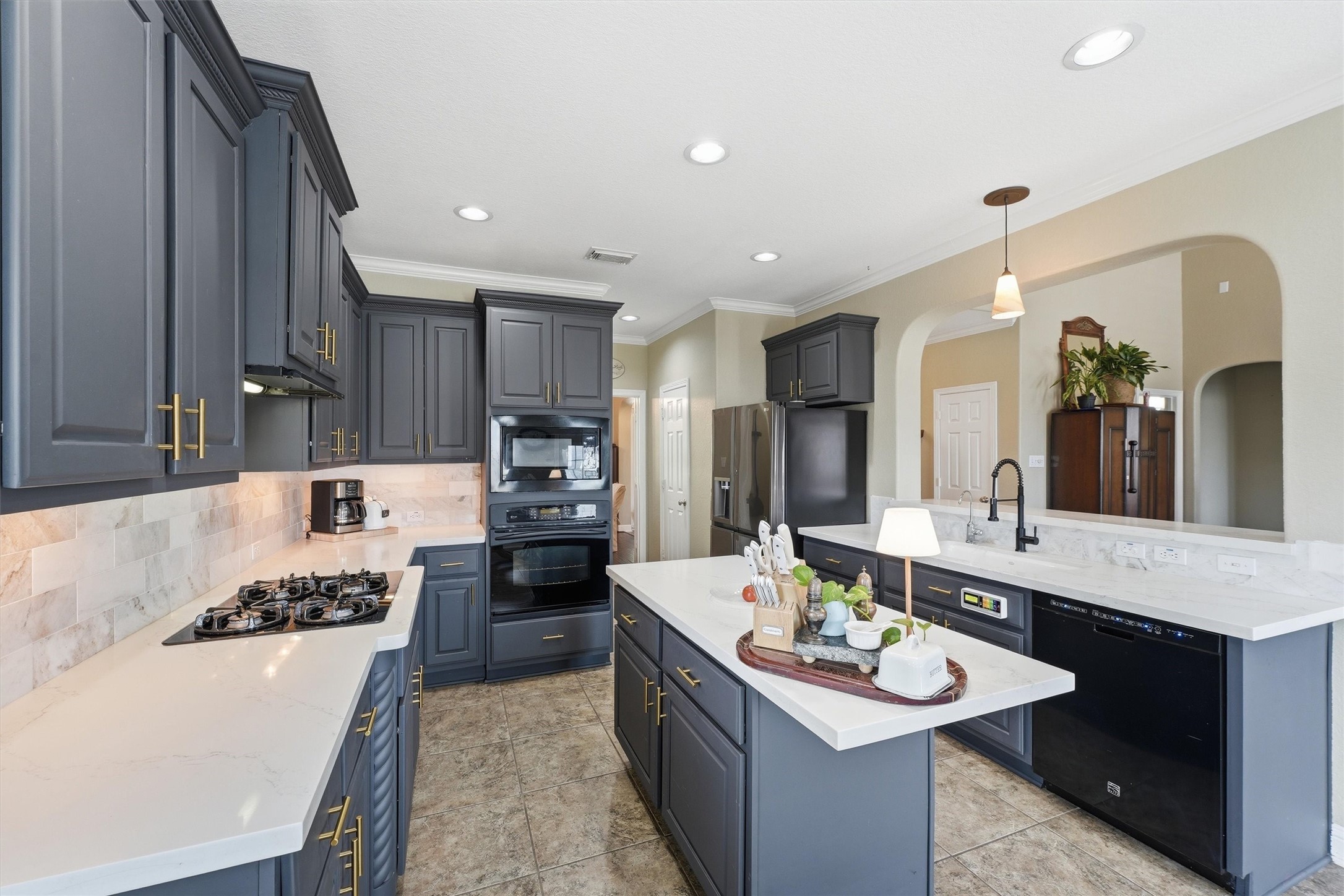 25181 Ramrock Drive Porter, TX 77365 - Photo 8 of 35 a large kitchen with kitchen island a sink stove and refrigerator