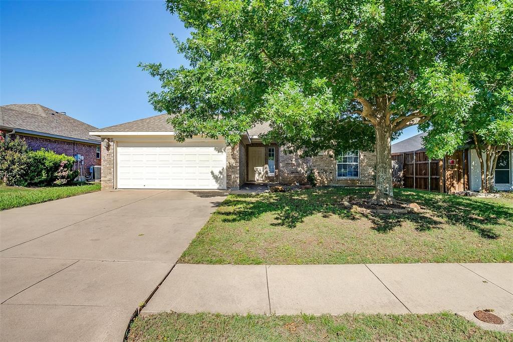 543 Thistle Meade Circle Burleson, TX 76028 - Photo 1 of 23 a front view of a house with a yard and a garage