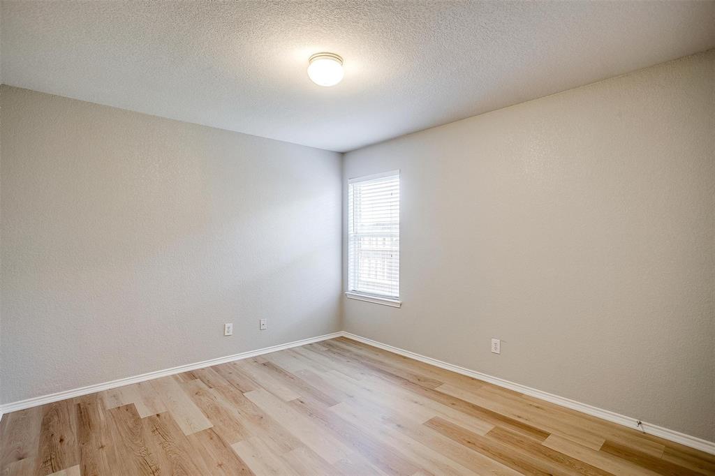 543 Thistle Meade Circle Burleson, TX 76028 - Photo 11 of 23 an empty room with a window