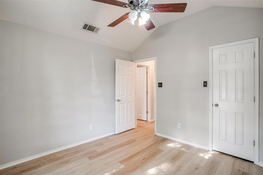543 Thistle Meade Circle Burleson, TX 76028 - Photo 15 of 23 a view of an empty room and wooden floor